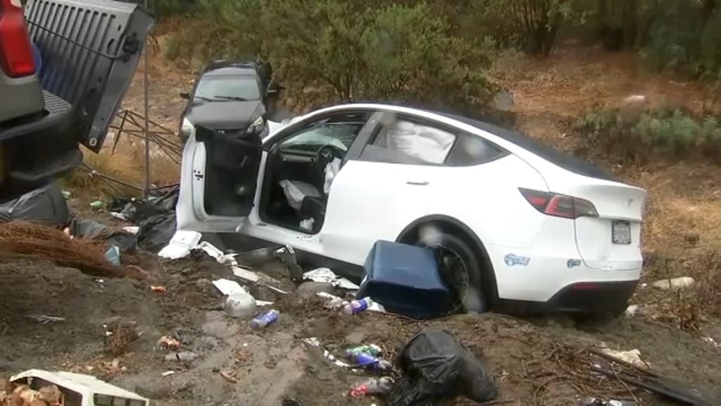 Driver crashes into food stand, plunges into riverbed
