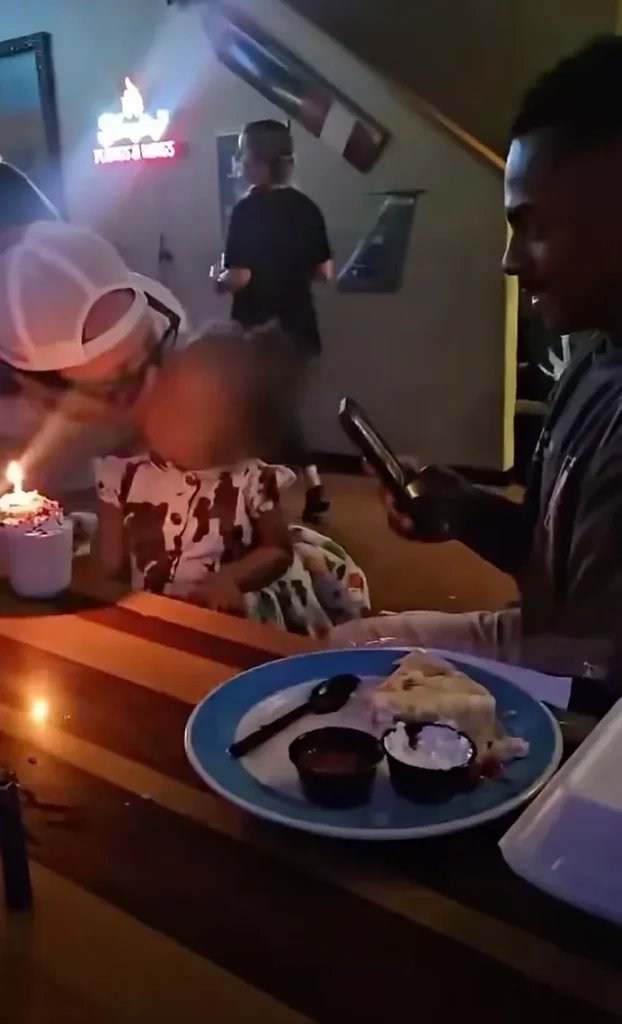 Bar owner kisses stranger’s toddler at birthday