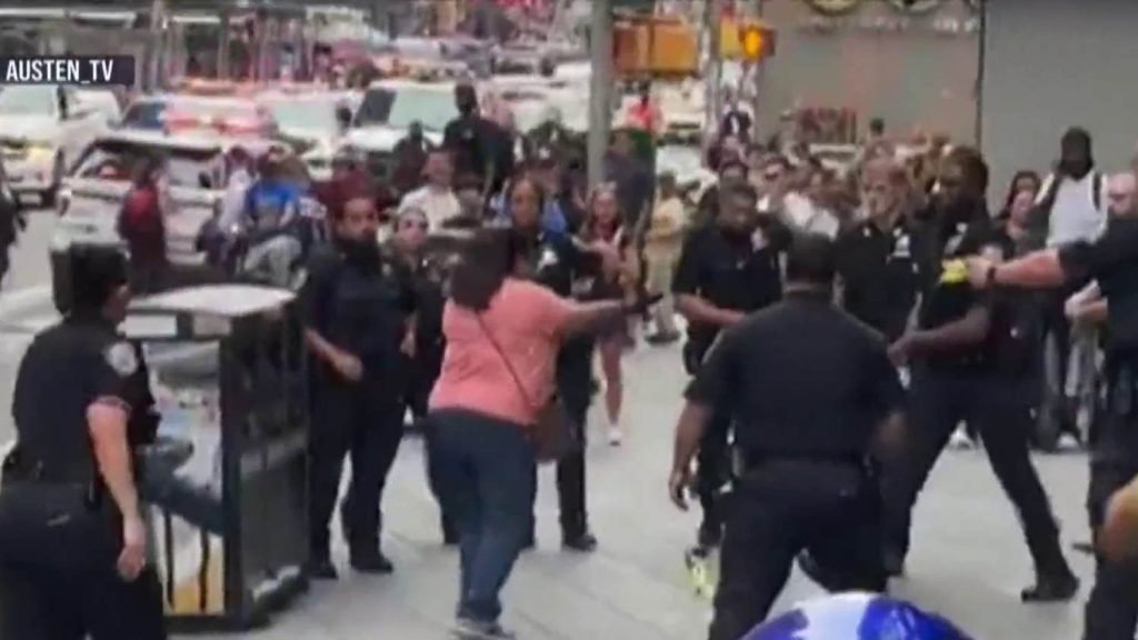 Woman stabs 2 in Times Square, shot by police