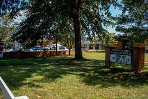 Gunman shot through school door, killed staffer