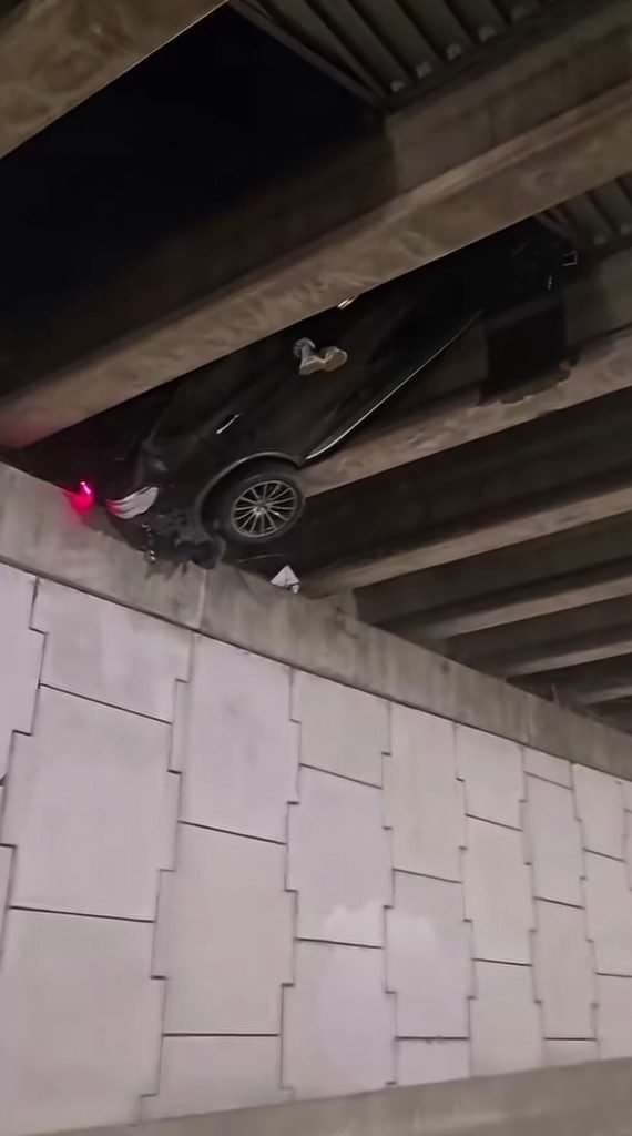 Car wedged 20 feet up in overpass: how it got there