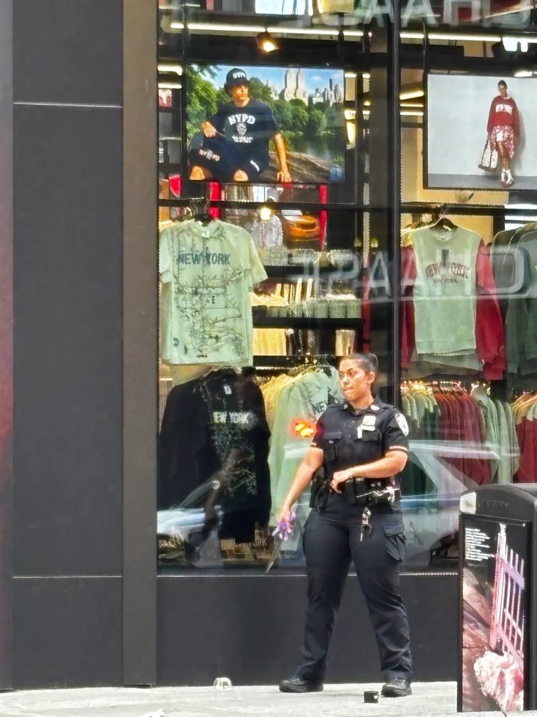 Woman shot by NYPD after stabbing 2 in Times Square