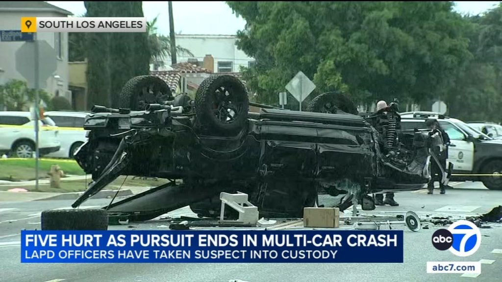 Police chase ends in crash that traps at least 1