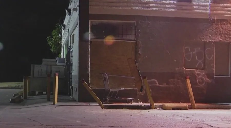 Woman arrested after car crashes into store