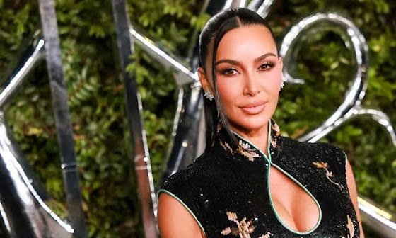 Kim Kardashian Bares Her Abs in a Molten Brown Snakeskin Bra and a Cutout Skirt