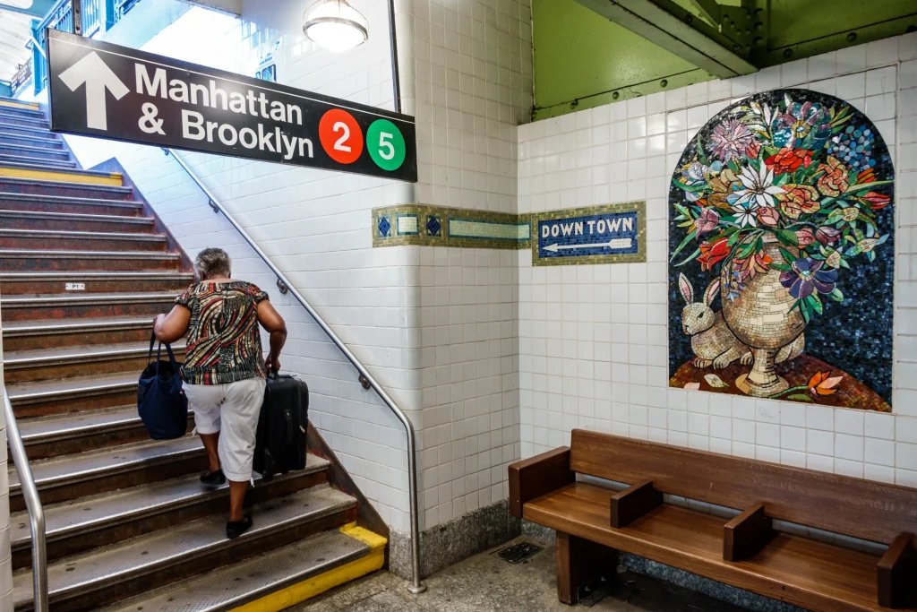 Man shoves woman onto subway tracks, then turns himself in