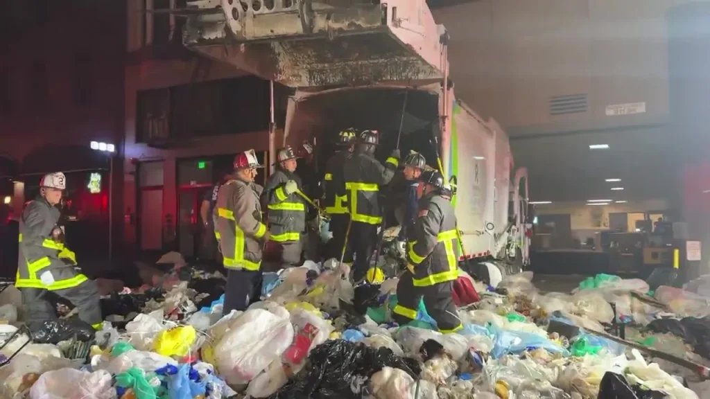 Homeless man trapped in garbage truck compactor