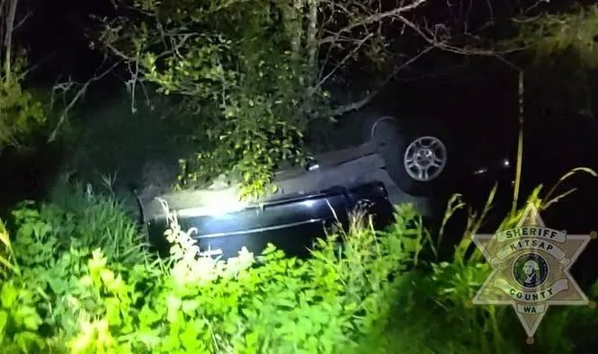 Woman arrested after rolling SUV, leaving scene