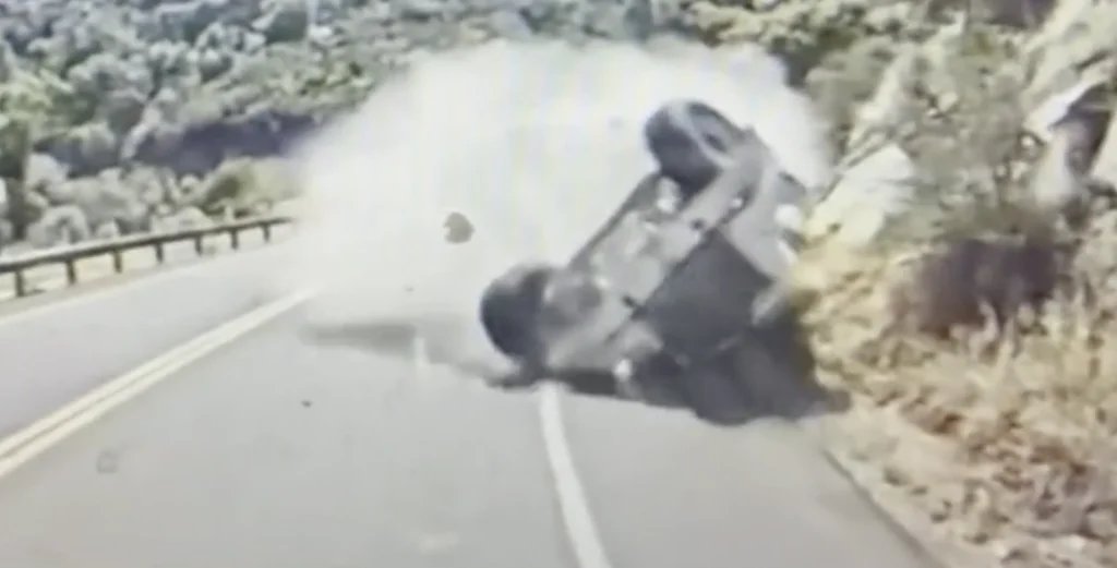 Cement truck flips, nearly hits tour bus, sparks wildfire